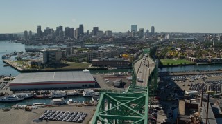 AX142_190E - 5.5K aerial stock footage of Tobin Memorial Bridge, Downtown Boston skyline, Charlestown, Massachusetts
