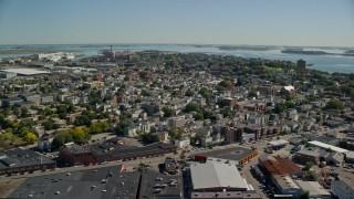 AX142_205E - 5.5K aerial stock footage flying by a residential neighborhood, South Boston, Massachusetts