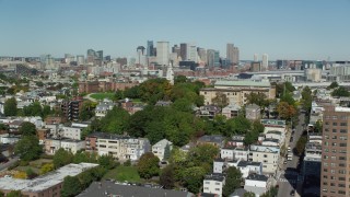 AX142_226 - 5.5K aerial stock footage of Dorchester Heights Monument, South Boston, Downtown Boston, Massachusetts