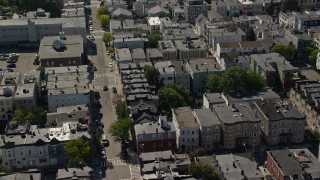 AX142_238 - 5.5K aerial stock footage flying by row houses, apartment buildings, South Boston, Massachusetts