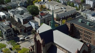 AX142_240 - 5.5K aerial stock footage approaching, flying by Gate of Heaven Catholic Church, South Boston, Massachusetts