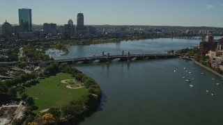 AX142_302E - 5.5K aerial stock footage approaching and flying over the Longfellow Bridge, Boston, Massachusetts