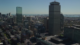 AX142_306E - 5.5K aerial stock footage flying by Prudential Tower, buildings, Downtown Boston, Massachusetts