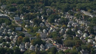 AX142_315E - 5.5K aerial stock footage flying by small residential town, Roslindale, Massachusetts