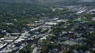 AX142_317 - 5.5K aerial stock footage flying by large strip mall, neighborhoods, Hyde Park, Massachusetts