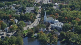 AX143_009 - 5.5K aerial stock footage flying by South Congregational Church, small town, autumn, Braintree, Massachusetts