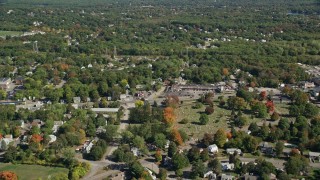AX143_012E - 5.5K aerial stock footage flying over small town neighborhoods, autumn, Weymouth, Massachusetts