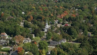 AX143_017E - 5.5K aerial stock footage flying over small town, trees, approach church, autumn, Hingham, Massachusetts