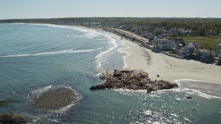 AX143_031E - 5.5K aerial stock footage flying by beach, upscale oceanfront homes, Scituate, Massachusetts