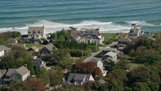 AX143_046 - 5.5K aerial stock footage flying by upscale oceanfront homes, Scituate, Massachusetts