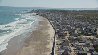 AX143_056E - 5.5K aerial stock footage flying over oceanfront homes, approaching coastal town, Marshfield, Massachusetts