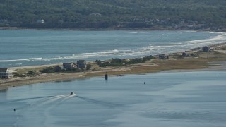 AX143_085 - 5.5K aerial stock footage flying by beach, oceanfront homes, Plymouth, Massachusetts