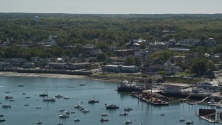 AX143_086E - 5.5K aerial stock footage approaching a harbor, small coastal community, Plymouth, Massachusetts