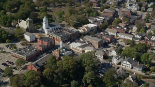 AX143_096 - 5.5K aerial stock footage orbiting churches and shops in the small town, Plymouth, Massachusetts