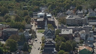 AX143_098 - 5.5K aerial stock footage flying by small town, church, historic building, Plymouth, Massachusetts