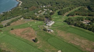 AX143_112E - 5.5K aerial stock footage approaching Plymouth Country Club, tilt down, Plymouth, Massachusetts
