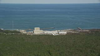 AX143_114E - 5.5K aerial stock footage flying by Pilgrim Nuclear Generating Station, Cape Cod Bay, Plymouth, Massachusetts