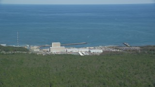 AX143_115 - 5.5K aerial stock footage flying by Pilgrim Nuclear Generating Station, Cape Cod Bay, Plymouth, Massachusetts