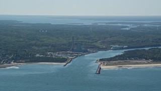 AX143_127E - 5.5K aerial stock footage flying by power plant, Cape Cod Canal, Sandwich, Cape Cod, Massachusetts