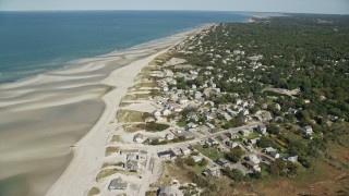 AX143_151E - 5.5K aerial stock footage flying over sand bars, approach small coastal town, Cape Cod, Dennis, Massachusetts
