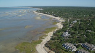 AX143_173 - 5.5K aerial stock footage flying over beach, beachfront homes, sand bars, Cape Cod, Brewster, Massachusetts