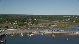 AX143_195E - 5.5K aerial stock footage flying over Chipman's Cove, approach Wellfleet Town Pier, Wellfleet, Massachusetts