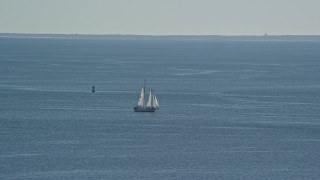 AX143_220 - 5.5K aerial stock footage flying by sailing boat, Cape Cod Bay, Massachusetts