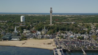 AX143_248E - 5.5K aerial stock footage approaching Pilgrim Monument, Provincetown Town Hall, Provincetown, Massachusetts
