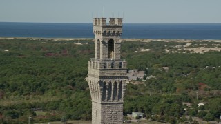 AX143_250 - 5.5K aerial stock footage orbiting the top of the Pilgrim Monument, Provincetown, Massachusetts