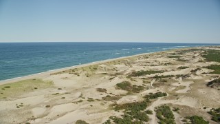 AX144_001E - 5.5K aerial stock footage flying over sand dunes, beach, Cape Cod, Provincetown, Massachusetts