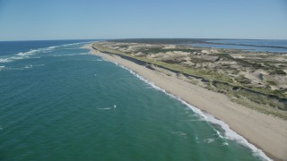 AX144_008 - 5.5K aerial stock footage flying by waves crashing on beach, Cape Cod, Truro, Massachusetts