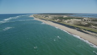 AX144_009 - 5.5K aerial stock footage flying by waves crashing, beach, Cape Cod, Truro, Massachusetts