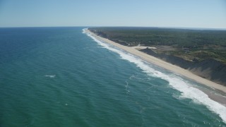 AX144_019 - 5.5K aerial stock footage flying by waves crashing on beaches, Cape Cod, Truro, Massachusetts