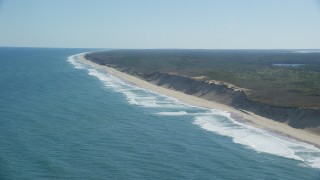 AX144_022 - 5.5K aerial stock footage flying by waves crashing, beaches, Cape Cod, Truro, Massachusetts