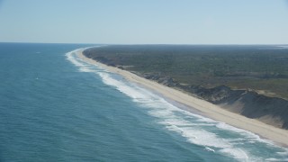AX144_023 - 5.5K aerial stock footage flying by waves crashing, beaches, Cape Cod, Truro, Massachusetts