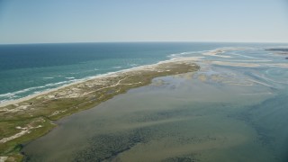 AX144_042E - 5.5K aerial stock footage flying by marshlands, beaches, sand bars at low tide, Orleans, Massachusetts