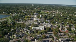 AX144_049E - 5.5K aerial stock footage flying by small coastal town, Cape Cod, Chatham, Massachusetts