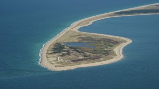 AX144_067 - 5.5K aerial stock footage flying by Great Point Light, island, Nantucket, Massachusetts