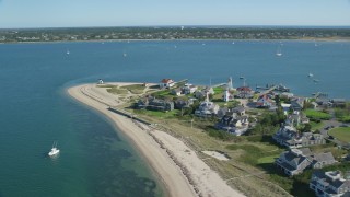 AX144_088 - 5.5K stock footage aerial video flying by oceanfront homes, Nantucket Harbor Lights, Nantucket, Massachusetts