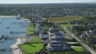 AX144_090 - 5.5K aerial stock footage of oceanfront properties, Nantucket Harbor Range Lights, Nantucket, Massachusetts