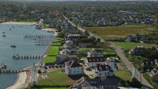 AX144_090E - 5.5K aerial stock footage of oceanfront properties, Nantucket Harbor Range Lights, Nantucket, Massachusetts