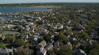 AX144_093E - 5.5K aerial stock footage flying by small island town, coastal community, Nantucket, Massachusetts