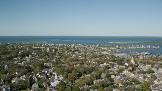 AX144_096E - 5.5K aerial stock footage flying by small coastal community, Nantucket Harbor, Nantucket, Massachusetts