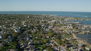 AX144_099E - 5.5K aerial stock footage flying over small coastal community near the harbor, Nantucket, Massachusetts
