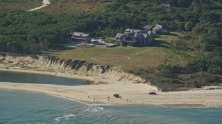 AX144_123E - 5.5K aerial stock footage of an isolated beachfront mansion, Chappaquiddick Island, Martha's Vineyard, Massachusetts