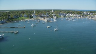AX144_134 - 5.5K stock footage aerial video flying over moored boats, approaching Edgartown, Martha's Vineyard, Massachusetts