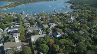 AX144_137 - 5.5K stock footage aerial video orbiting small coastal town, Edgartown, Martha's Vineyard, Massachusetts