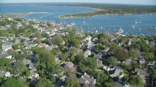 AX144_138 - 5.5K stock footage aerial video orbiting small coastal town, Edgartown, Martha's Vineyard, Massachusetts