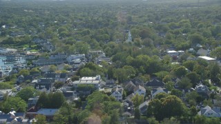 AX144_143 - 5.5K stock footage aerial video flying by small coastal town, Edgartown, Martha's Vineyard, Massachusetts