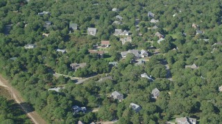 AX144_150 - 5.5K stock footage aerial video flying by island homes, forest, Edgartown, Martha's Vineyard, Massachusetts